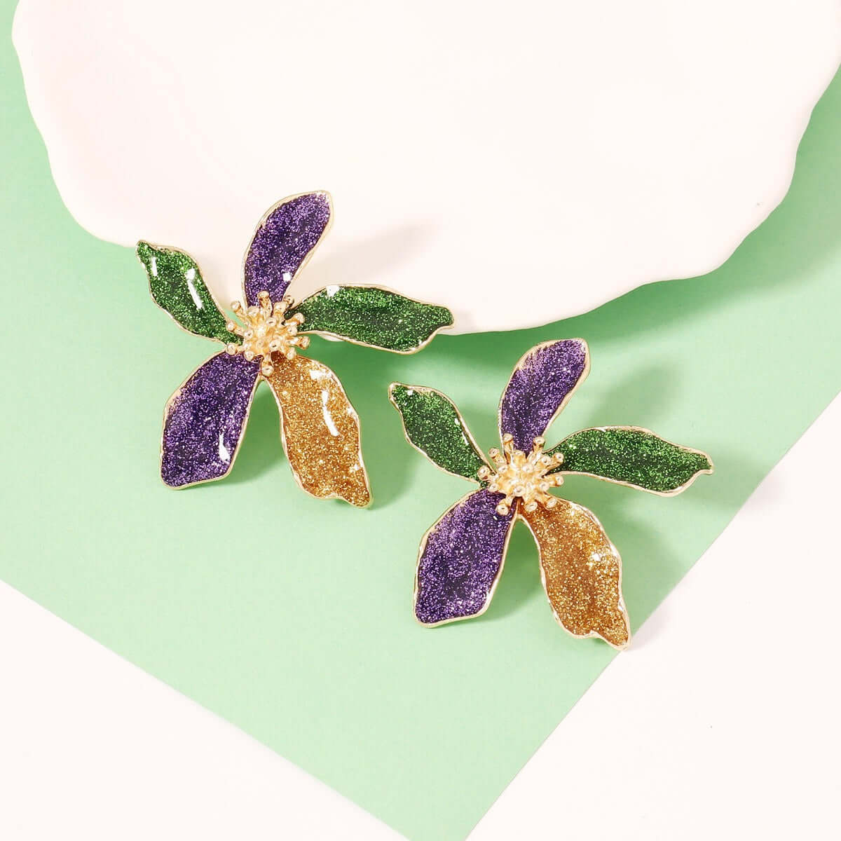 Elegant design trendy versatile earring accessories for women featuring colorful flower design in green, purple, and gold.