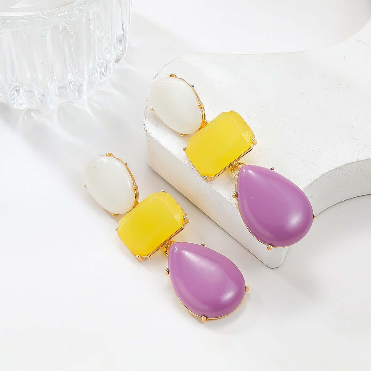 Colored resin earrings for women with Bohemian style exaggerated accessories on a display.
