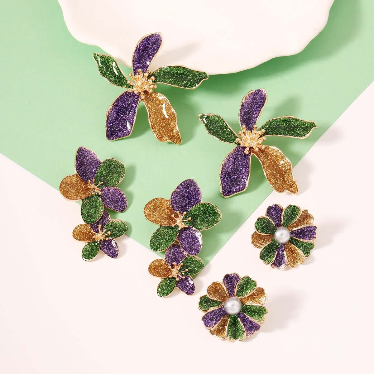 Elegant design trendy versatile earring accessories for women featuring colorful floral patterns in gold, green, and purple.