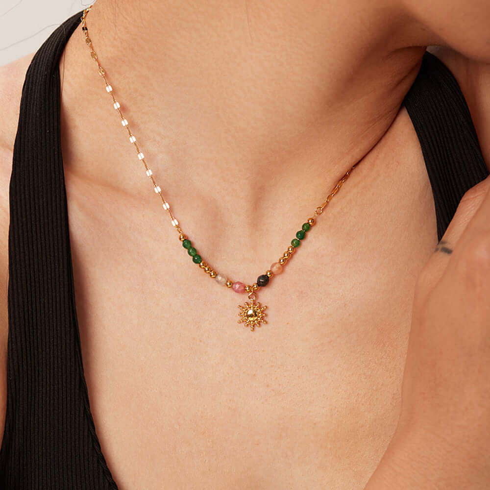 French fashion retro INS style necklace, sun pendant, accessories for women worn by a model.