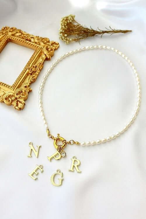24 Karats Custom Initial  Freshwater Pearls Front Opening Choker with gold letter charms and natural pearls.